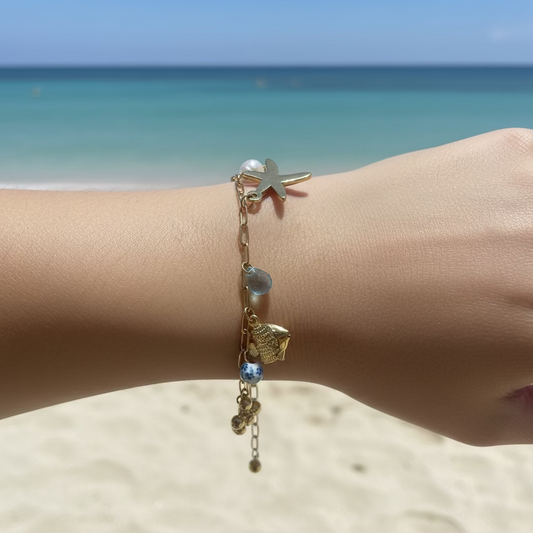GLOW OCEAN BRACELET – Bracciale Marittimo con Charms Stella, Pesce, Delfino e Pietre – Eldra Milano