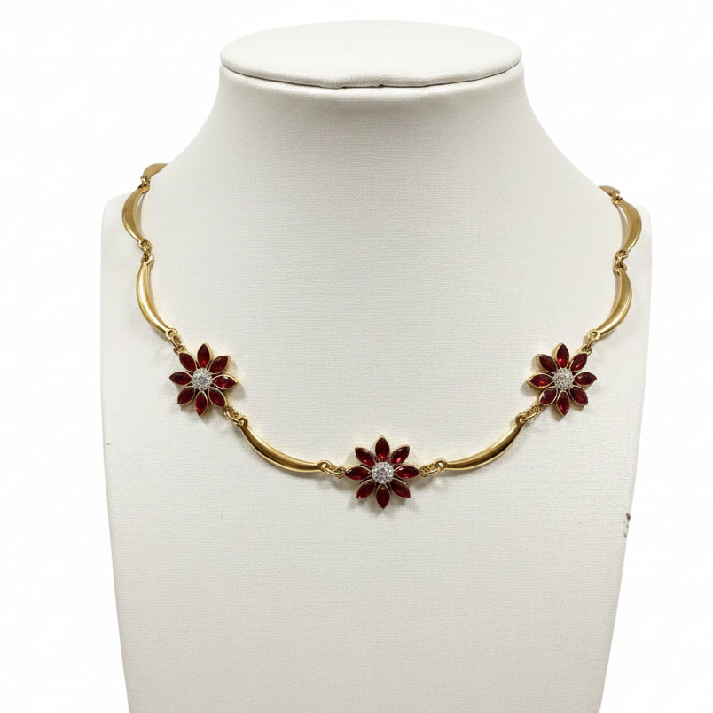 Collana essenzial curva flora | zirconi rossi e acciaio